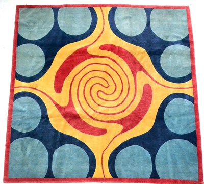 Lot 468 - Modernist Carpet The soft corn field centred by a swirling design framed by indigo spandrels...