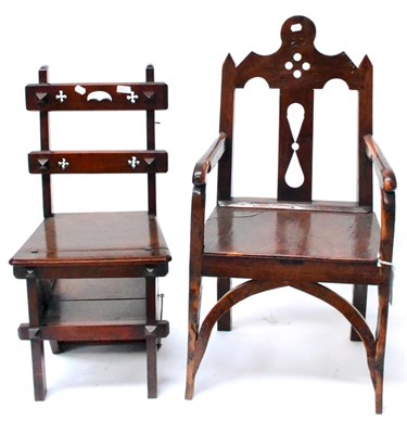 Lot 483 - An Unusual Yewwood Armchair, of joined construction, with Gothic style back, boarded seat and...