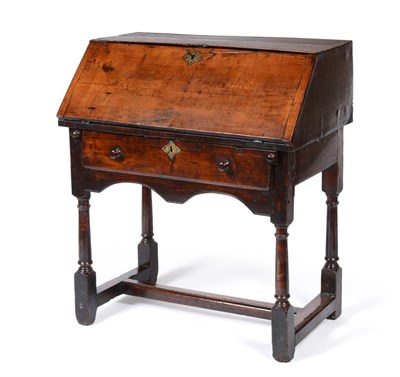 Lot 485 - An Early 18th Century Pearwood Desk on Stand, the desk with a hinged slope and fitted interior, the