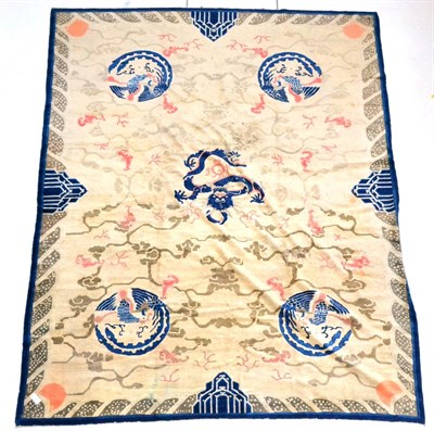 Lot 488 - Peking Carpet, circa 1890 East China The ivory field with a lattice centred by a dragon...