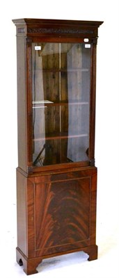 Lot 492 - A Small Mahogany Display Cabinet, with a moulded cornice above a glazed door enclosing shelves,...