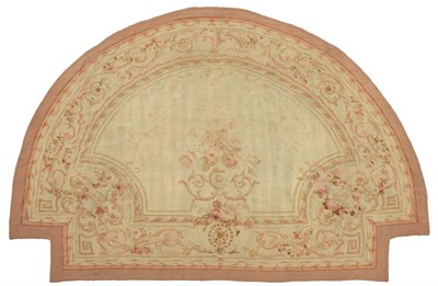 Lot 493 - Aubusson Carpet Central France Of demi-lune form, the pale corn field centred by an urn issuing...