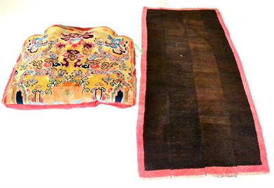 Lot 499 - Tibetan Throne Rug The shaped lemon field with dragons enclosed by narrow leafy borders, now as...