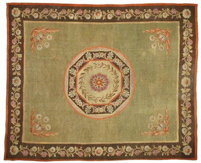 Lot 504 - Fine Aubusson Carpet, circa 1810 The plain apple green field centred by a roundel containing an...