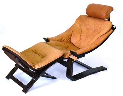 Lot 521 - A 1970's Easy Chair and Footstool, bent beechwood frame with tan leather upholstery, unmarked,...