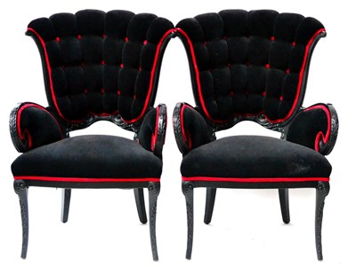 Lot 526 - A Pair of Modern Easy Chairs, upholstered in deep buttoned black dralon with red piping, with...