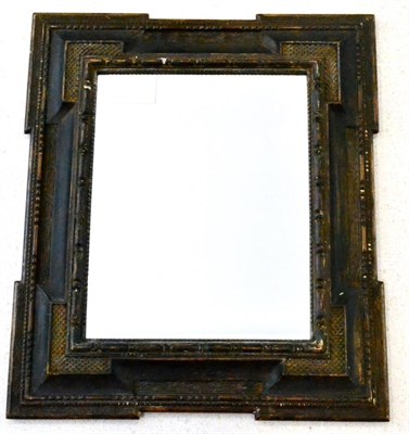 Lot 527 - An 18th Century Dutch Ebonised Wall Mirror, the rectangular plate in stepped and cushioned...