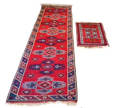 Lot 534 - Tibetan Throne Rug The diamond medallion containing a phoenix framed by floral spandrels and indigo