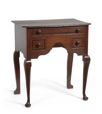 Lot 541 - An Oak and Mahogany Crossbanded Lowboy, the top with re-entrant corners over a frieze drawer...