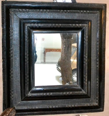 Lot 542 - A 18th Century Dutch Ebonised Wall Mirror, the rectangular plate within stepped rectangular...