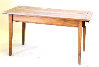 Lot 558 - A French Cherrywood Farmhouse Table, the rectangular cleated top over a drawer to one end, on...