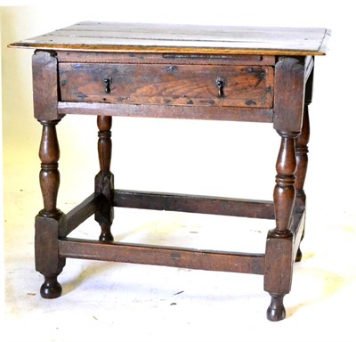 Lot 564 - A Joined Oak Side Table, the moulded top over a frieze drawer, on turned opposed baluster legs...