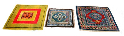 Lot 570 - Tibetan Throne Rug The field with central tiger panel enclosed by olive green and crimson...