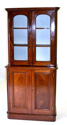 Lot 573 - A Victorian Mahogany Glazed Bookcase, mid 19th century, with moulded cornice above two arched...