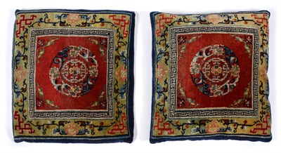 Lot 582 - Pair of Tibetan Rugs Each with a chestnut brown field centred by a roundel enclosed by apple...