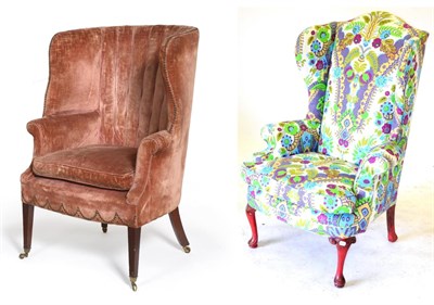 Lot 592 - A George III Style Wing Easy Chair, upholstered in puce ''velvet''; and Another Wing Easy Chair (2)