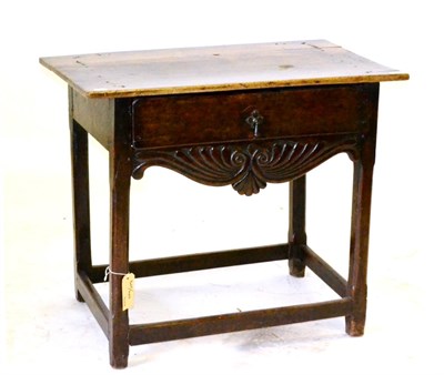 Lot 599 - A 19th Century French Walnut and Cherry Side Table, with a frieze drawer and shaped anthemion...