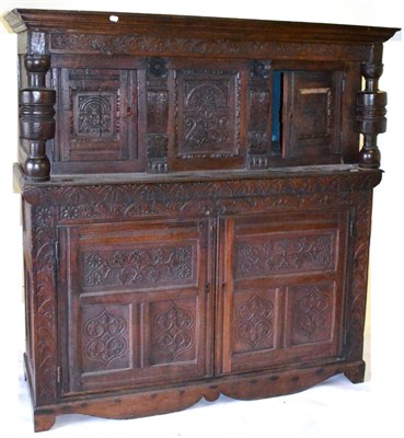 Lot 610 - A Joined Oak Press Cupboard, carved in 17th century style, the canopy with moulded cornice and...