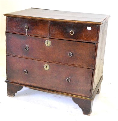 Lot 611 - A Small Early 18th Century Oak and Pine Chest of Drawers, with a crossbanded top over two short and