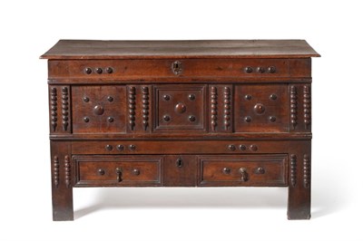 Lot 615 - A Late 17th Century Joined Oak Chest, with a boarded lid over three square panels decorated...