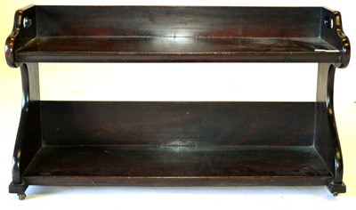 Lot 618 - A Mahogany Two-Tier Bookshelf/Carrier, with shaped end supports and pierced apertures for...