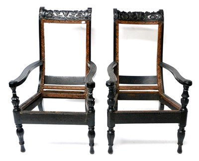 Lot 622 - A Pair of 19th Century Singhalese Ebony Framed Easy Chairs (lacking upholstery)