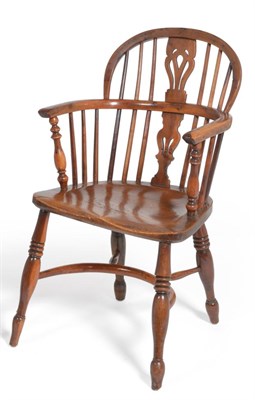 Lot 624 - A 19th Century Yewwood and Elm Windsor Armchair, with a low double bow back, pierced splats, turned