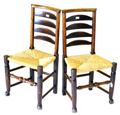 Lot 626 - A Pair of 19th Century Ash and Alder Lancashire Ladder Back Chairs, with rush seats, turned...