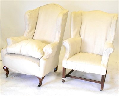 Lot 640 - A George III Style Wing Easy Chair, with a cream coloured loose cover, on square legs with...