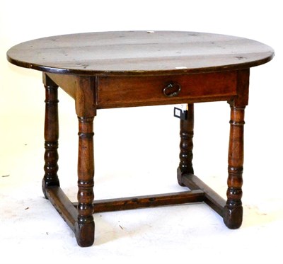 Lot 648 - A Joined Oak Table, the oval top above a frieze drawer, on turned legs joined by an H...