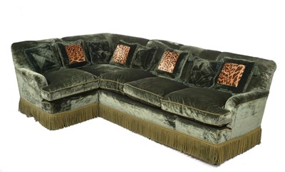 Lot 654 - A Large Corner Sofa, upholstered in deep green plush, 160cm by 250cm   Supplied by Tom Parr of...