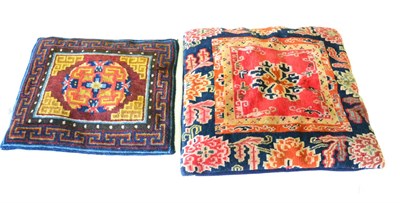 Lot 659 - Tibetan Rug The crimson field with central lotus flower enclosed by indigo borders of peony,...