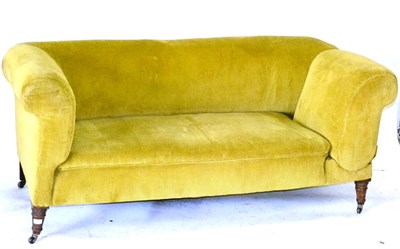 Lot 661 - A Victorian Drop-End Sofa, upholstered in green corduroy, on turned feet with castors, 175cm long