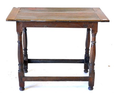 Lot 672 - An English Joined Oak Side Table, 18th century in part, the boarded top with cleated ends,...