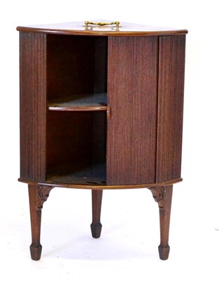 Lot 676 - A Small George II Mahogany Corner Cabinet, of quadrant form, with a tambour front enclosing two...