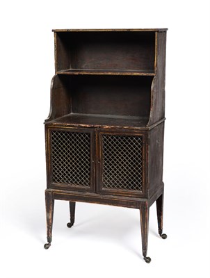 Lot 677 - A Small Japanned Bookcase, with two graduated shelves above a pair of brass lattice doors, on...