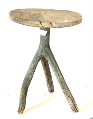 Lot 679 - A 19th Century Oak Tripod Table, the circular top formed from a cross-section of a tree trunk,...