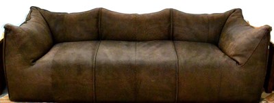 Lot 682 - A Pair of Large Sofas, covered in heavily textured brown leather, 230cm long