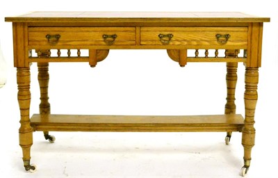 Lot 686 - A Late Victorian Oak Writing Table, circa 1890, with modern leather and gilt skiver above two...