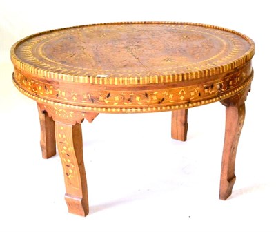 Lot 691 - A Colonial Hardwood and Marquetry Inlaid Circular Coffee Table, decorated with Arabic style motifs