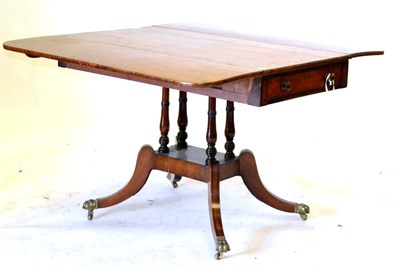 Lot 692 - A Regency Mahogany Pembroke Table, with a round cornered top and a drawer to each end, on four...