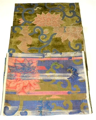 Lot 701 - A 19th Century Sino-Tibetan Pillar Rug, woven with pink lotus and bats against blue vines, 66cm...