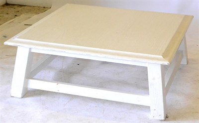 Lot 703 - A White Painted Low Table, with a square top and splayed square legs joined by stretchers, 115cm by