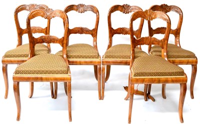 Lot 704 - A Set of Six Late 19th Century French Walnut Chairs, with double arched anthemion and leaf...