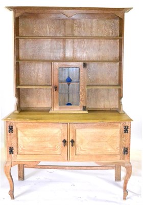 Lot 705 - An Oak Arts & Crafts Dresser, late 19th century, the top section with three fixed shelves above...