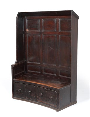 Lot 713 - A 19th Century Panelled Pine Settle, slightly curved and with one closed and one open end, a curved