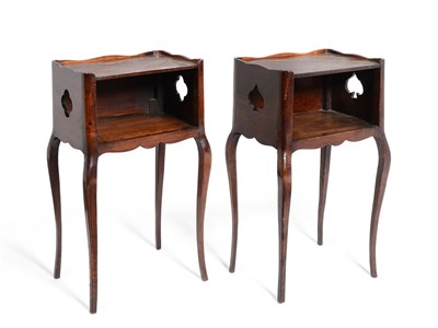 Lot 714 - A Pair of 19th Century French Walnut Bedside Tables, the round cornered tops with wavy rims,...