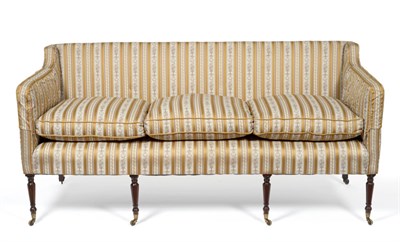 Lot 717 - A Regency Sofa, with low rectangular back and sides, on turned feet with castors, upholstered...