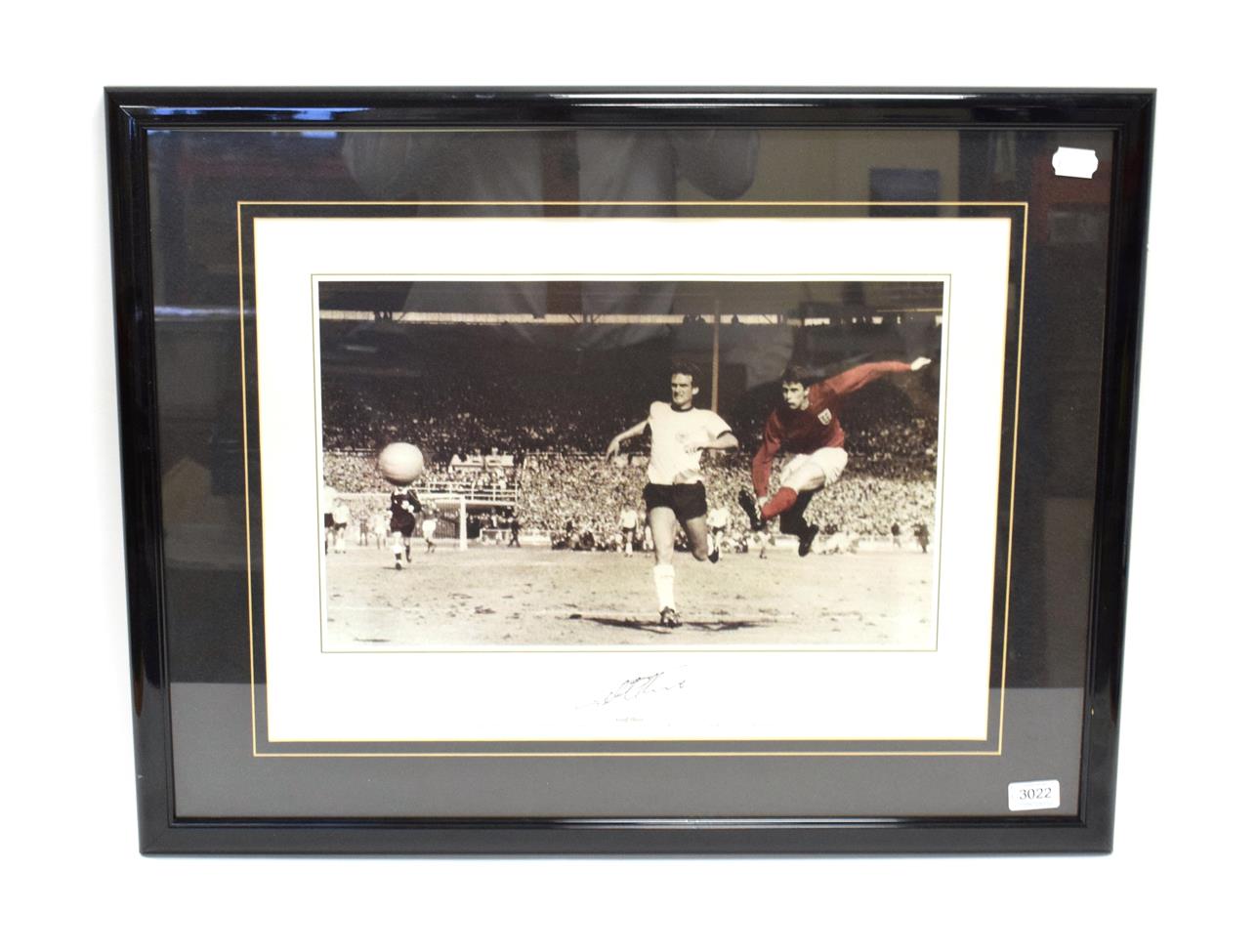 Lot 3012 - Geoff Hurst Signed Photograph showing Hurst scoring the fourth goal in the 1966 World Cup Final
