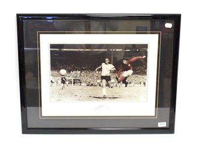 Lot 3012 - Geoff Hurst Signed Photograph showing Hurst scoring the fourth goal in the 1966 World Cup Final